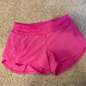 Speed up mid rise 4 in shorts in sonic pink